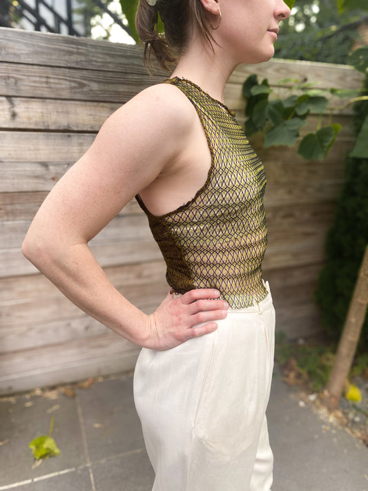 black and yellow large gage mesh front and wool knit back crop tank, side view