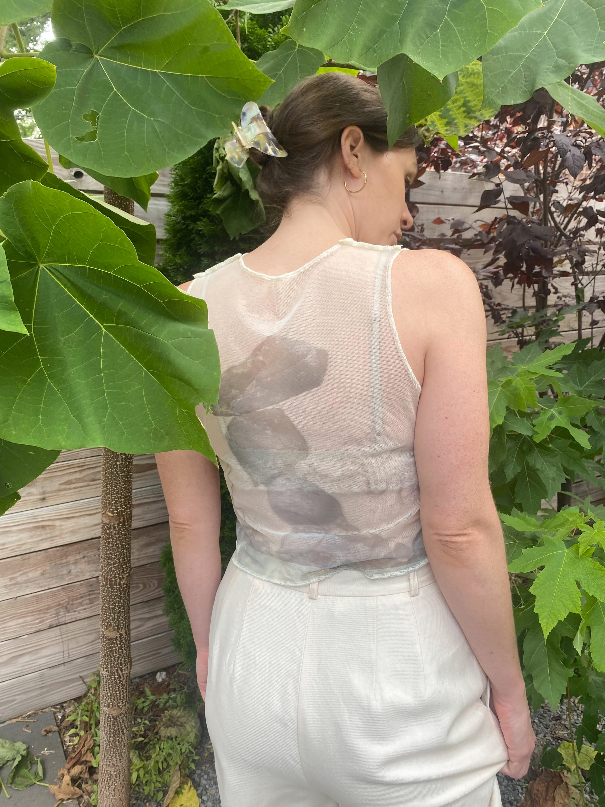 white mesh vest with rock print, back view