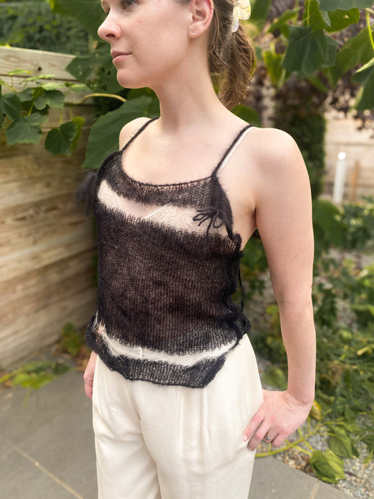 model wears black and white knit mohair tank, 3/4 view